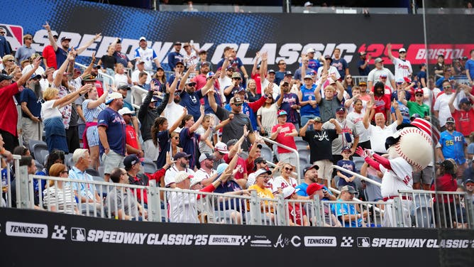 Cincinnati Reds mascot Mr. Redlegs throws fans t-shirts during the t-shirt toss during the 2025 MLB Speedway Classic between the Atlanta Braves and the Cincinnati Reds at Bristol Motor Speedway.