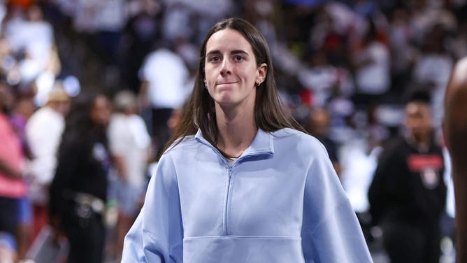 Indiana Fever superstar Caitlin Clark watches from the sideline during the opening weekend of the WNBA playoffs, as ratings draw new scrutiny under updated Nielsen methods.