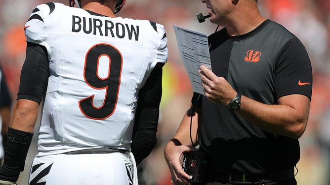 Cincinnati Bengals head coach Zac Taylor (right) talks with quarterback Joe Burrow during Week 1 against the Cleveland Browns.