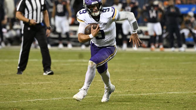 Minnesota Vikings quarterback J.J. McCarthy rushes the ball against the Chicago Bears during Week 1.
