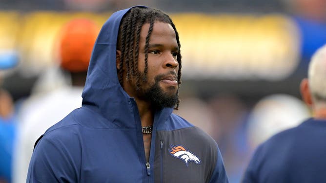 Denver Broncos LB Dre Greenlaw on the field before an NFL game.