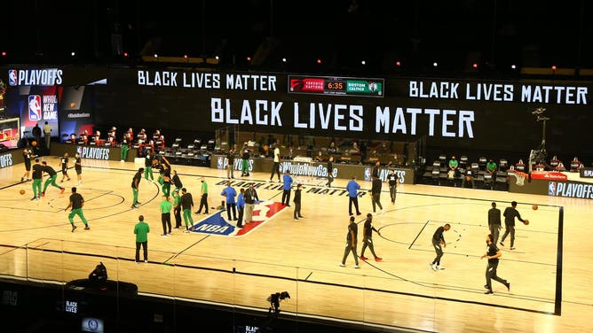 Black Lives Matter signage is shown above the court before game one of the second round of the 2020 NBA Playoffs between the Boston Celtics and the Toronto Raptors at The Field House.