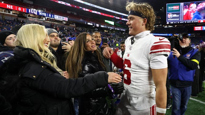 Ring girl Marissa Ayers and Giants quarterback Jaxson Dart
