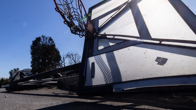 Basketball goal gets taken down by twerking woman