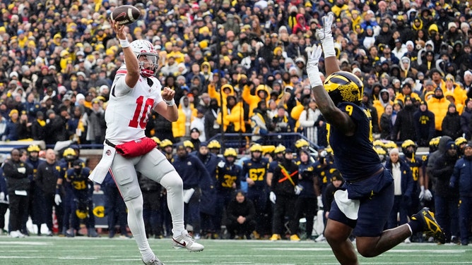Ohio State Buckeyes QB Julian Sayin throws on the run vs. the Michigan Wolverines in Ann Arbor. (Photo credit: Adam Cairns/Columbus Dispatch-USA TODAY NETWORK via Imagn Images)