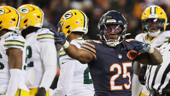 Chicago Bears running back Kyle Monangai (25) gestures toward the Green Bay Packers end zone after running for a first down.