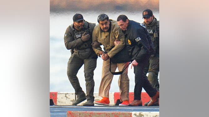 NEW YORK, NY - JANUARY 5: Nicolas Maduro is seen in handcuffs after landing at a Manhattan helipad, escorted by heavily armed Federal agents as they make their way into an armored car en route to a Federal courthouse in Manhattan on January 5, 2026 in New York City. (Photo by XNY/Star Max/GC Images via Getty Images)