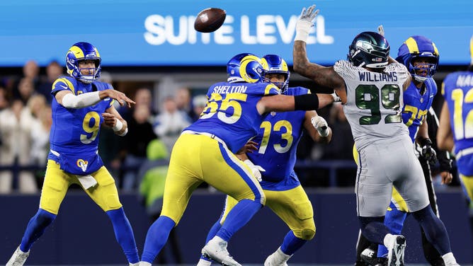 Los Angeles Rams QB Matthew Stafford throws a pass vs. the Seattle Seahawks at Lumen Field in NFL. Week 16. (Photo credit: Brooke Sutton/Getty Images)