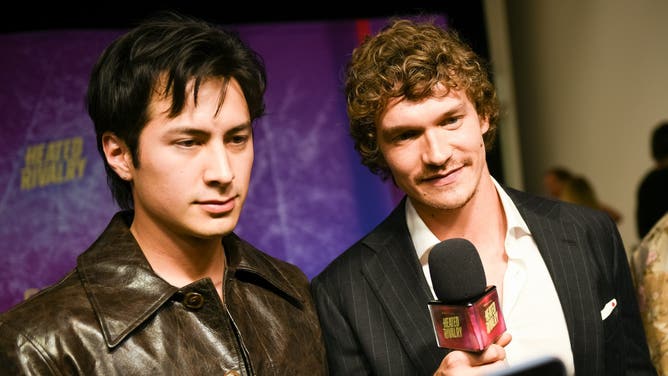 Connor Storrie and Hudson Williams speak to the media during the premiere of "Heated Rivalry" at TIFF Lightbox in Toronto, Ontario.