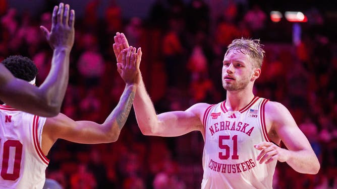 Nebraska Cornhuskers forward Rienk Mast (51) high fives guard Jamarques Lawrence (10) after defeating the Winthrop Eagles.