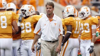 Former Tennessee coach Lane Kiffin and Alabama assistant Jeremy Pruitt were battling for AJ McCarron, thanks to Nick Saban