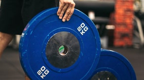 Iranian Weightlifter Banned For Life After Shaking Hands Of Israeli