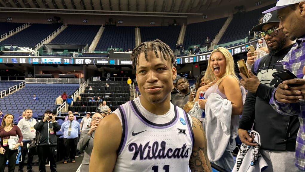 Kansas State player Keyontae Johnson reacts to a KSU fan
