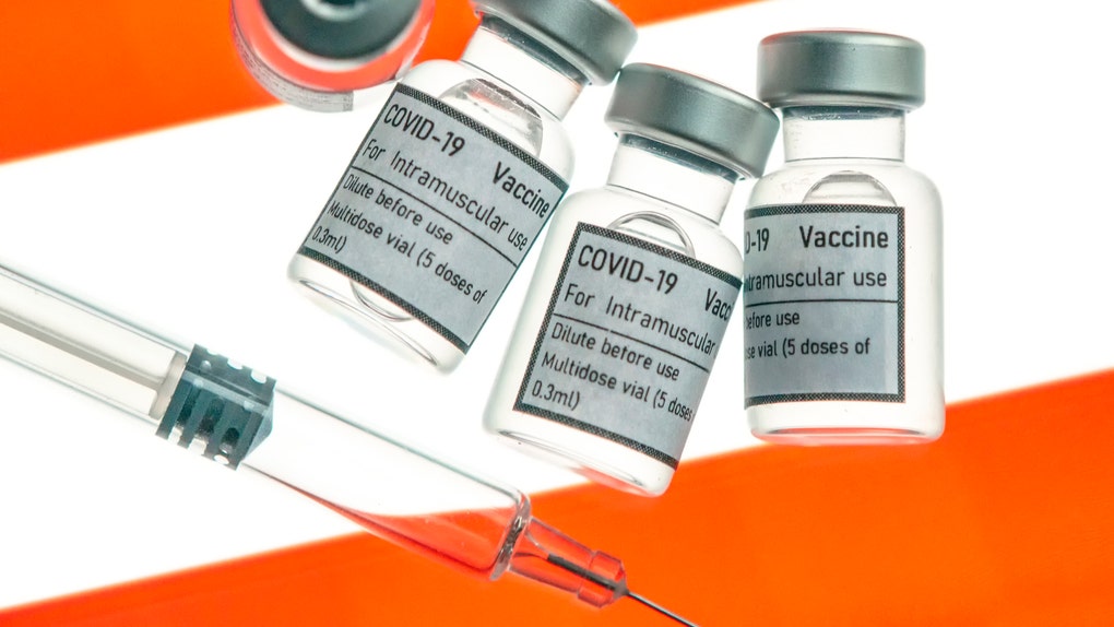 Vial ampoule vaccine for Corona Virus Covid-19 with Flag of Austria