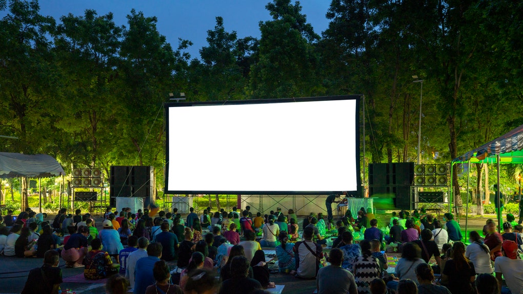 Spectators at Open-Air cinema summer night