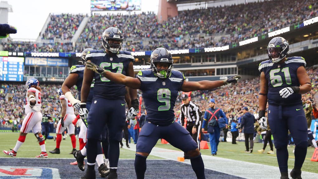 Seahawks RB Kenneth Walker III celebrates a TD against the New York Giants at Lumen Field in Seattle, Washington.