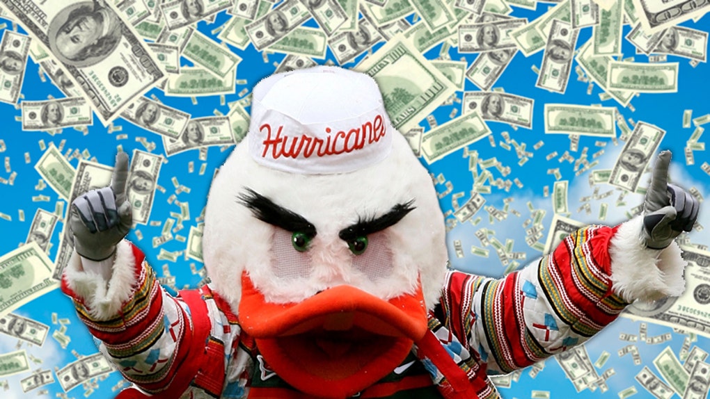 Hurricanes mascot surrounded by $100 bills