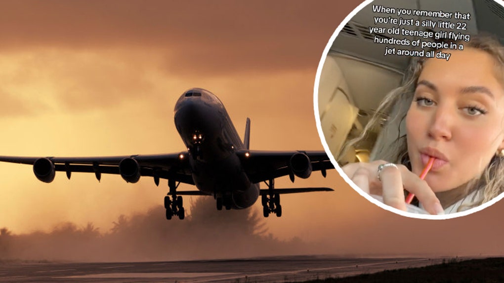 Airbus A340-313X take-off at dusk from a rainy wet runway with the engine exhaust making water spray
