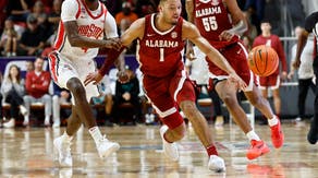Alabama Crimson Tide guard Mark Sears and Ohio State Buckeyes guard Dale Bonner battle for a lose ball at Raider Arena in Niceville, Florida.