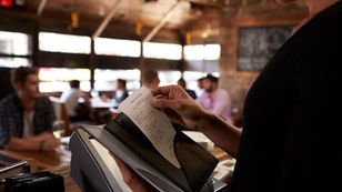 Preparing the bill at a restaurant to be taken to a table