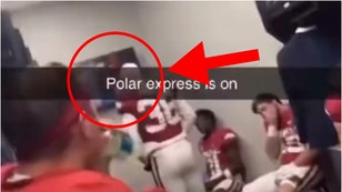 Arkansas players watch "Polar Express" during halftime of Auburn blowout. (Credit: Screenshot/Twitter Video https://twitter.com/BunkiePerkins/status/1723508335884784044)