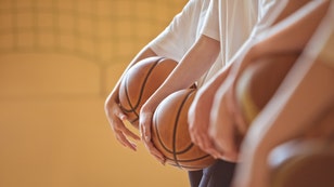 High school basketball players in gym