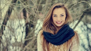 b0e895ec-Beautiful young woman in winter park