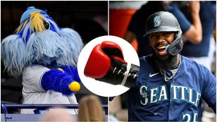 Tampa Bay rays mascot Raymond and Seattle Mariners outfielder eoscar Hernández