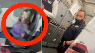 TikTok video shows woman on American Airlines plane duct-taped to her seat after she tried to open the door mid-flight