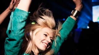 Portrait of woman having fun at music event