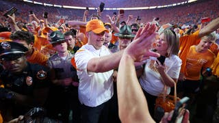 Tennessee head coach Josh Heupel celebrates the win over Alabama with fans