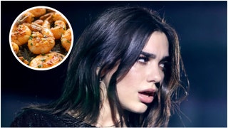 Did Dua Lipa pretend to grill shrimp for a little attention? X roasted her attempt to grill shrimp. Was it real? Watch the video. (Credit: Getty Images)