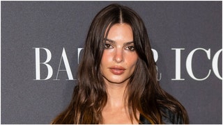 Emily Ratajkowski's standards for men post-divorce might not be overly high. She joked she'll date anyone willing to buy her dinner. (Credit: Getty Images)