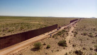 df05cf9c-An Aerial View Of The International Border Wall With Portions Still Under Construction