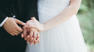 01029bf2-Close-Up Of Couple Holding Hands