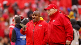 Offensive Coordinator Eric Bieniemy talks with head coach Andy Reid of the Kansas City Chiefs prior to the AFC Divisional Playoff game.