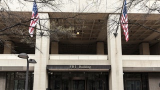 FBI Building Entrance Flanked by Flags