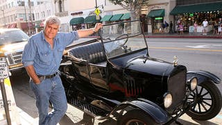 Jay Leno poses with car