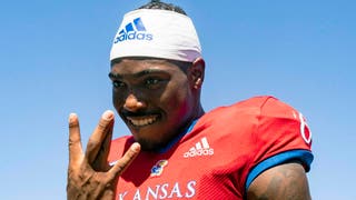 Kansas star quarterback Jalon Daniels unlikely to play against Oklahoma. (Photo by Jay Biggerstaff/Getty Images)
