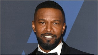 Jamie Foxx was nothing but smiles after being spotted for the first time since suffering a medical emergency. He was on a boat. (Credit: Getty Images)