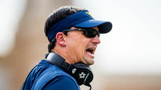 WVU coach Neal Brown reacts to West Virginia having a disappointing season. (Photo by John E. Moore III/Getty Images)