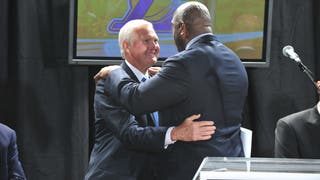 Jerry West and Magic Johnson embrace