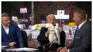 Lee Corso is back and holding a live duck on ESPN College Gameday.