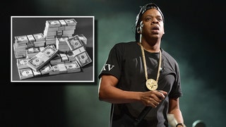 Jay-Z and stacks of money