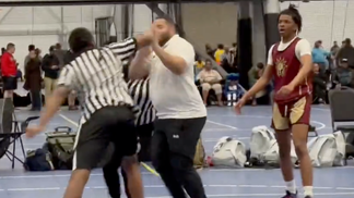 37957944-AAU-coach-ref-trade-punches