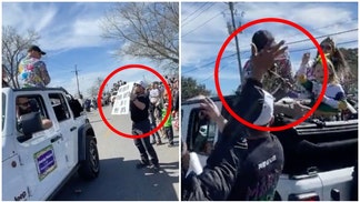 UFC fighter Dustin Poirier smacks man holding a sign disrespecting his wife. (Credit: Screenshot/Twitter Video https://twitter.com/TheArtOfWar6/status/1628040279176388608)
