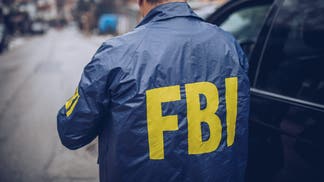 The back of an FBI agent