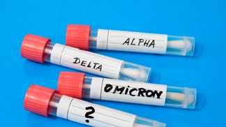 Swab tubes with medical samples on blue background
