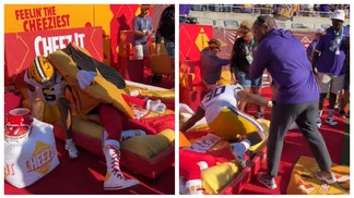 LSU players take out Cheez-It mascot.
