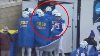 South Dakota State players stay warm during playoff game against Villanova. (Credit: Screenshot/X Video https://twitter.com/barstoolsports/status/1733550601378705660)
